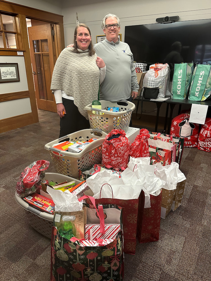 A sponsor from the Kirchner family posing with presents.