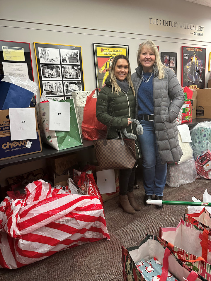 Sponsors from Lauterbach & Amen posing with presents.